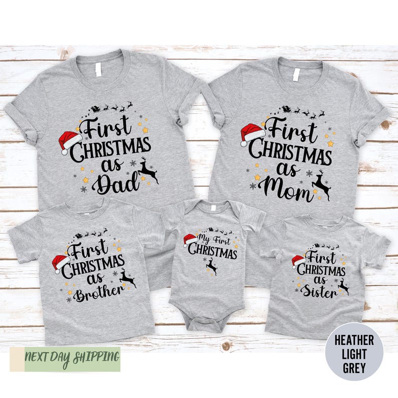 a family of three wearing matching christmas shirts