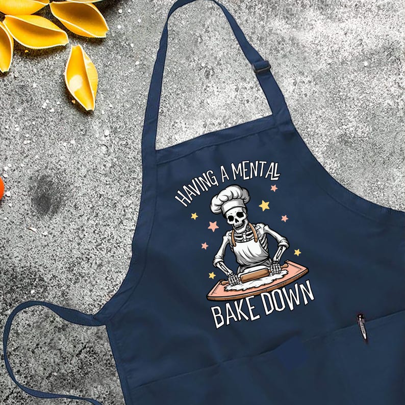a blue apron that says baking a mental bake down