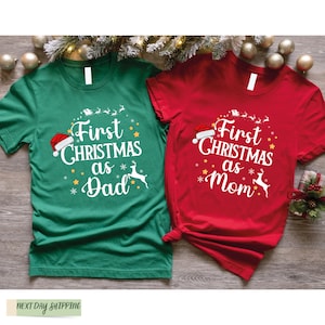 two t - shirts that say first christmas as a mom and first christmas as a