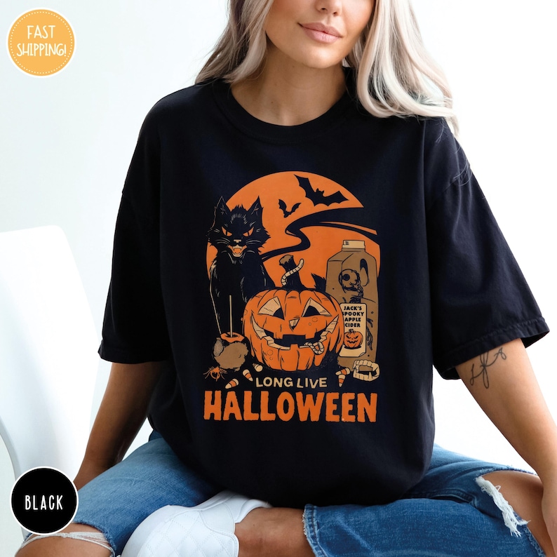 a woman wearing a black long live halloween t - shirt