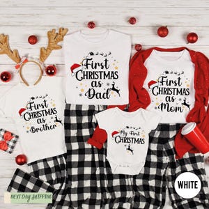 a family of three wearing matching christmas pajamas
