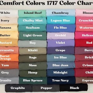 a group of different colored sheets and pillows