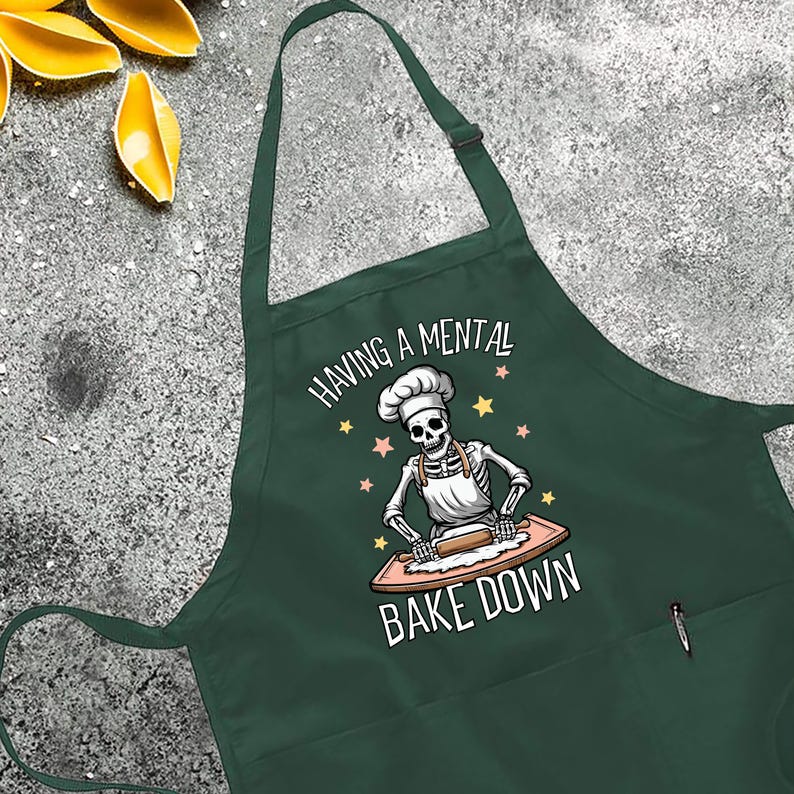 a green apron that says baking a mental bake down