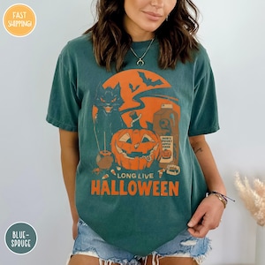a woman wearing a green halloween t - shirt