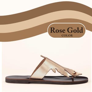 Infographic for handmade, top-grain, leather thong style sandal in metallic rose gold, with oak-leaf cutout design. Features deep brown colour, full-grain leather midsole. Callout bubble says -Rose Gold Color. Shown in a profile view of a single sandal. Photographed on a clean, white background.