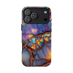 May include: A smartphone case with a vibrant, abstract design. The case features a cracked, mosaic-like pattern in shades of blue, purple, orange, and yellow, with brown vein-like lines. The camera module is black.