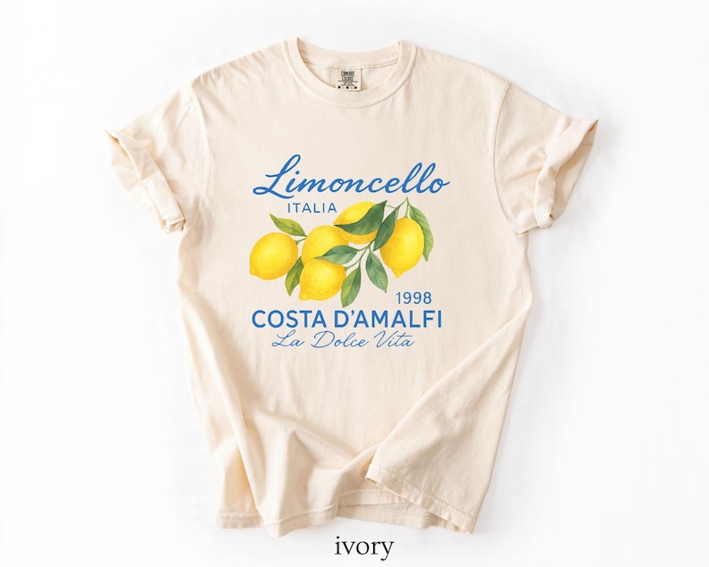 a white t - shirt with a picture of lemons on it