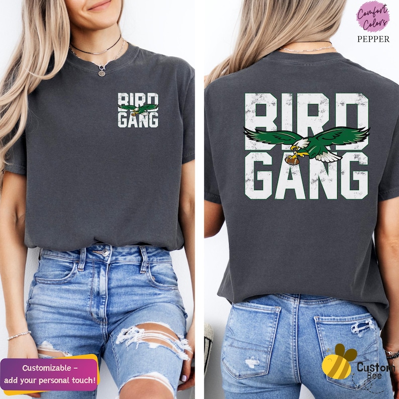 a woman wearing a bird gang t - shirt