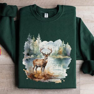 Retro Distressed Deer Wilderness Scene Sweatshirt | 90s Vintage Buck Crewneck | Boho Unisex Deer Sweatshirt