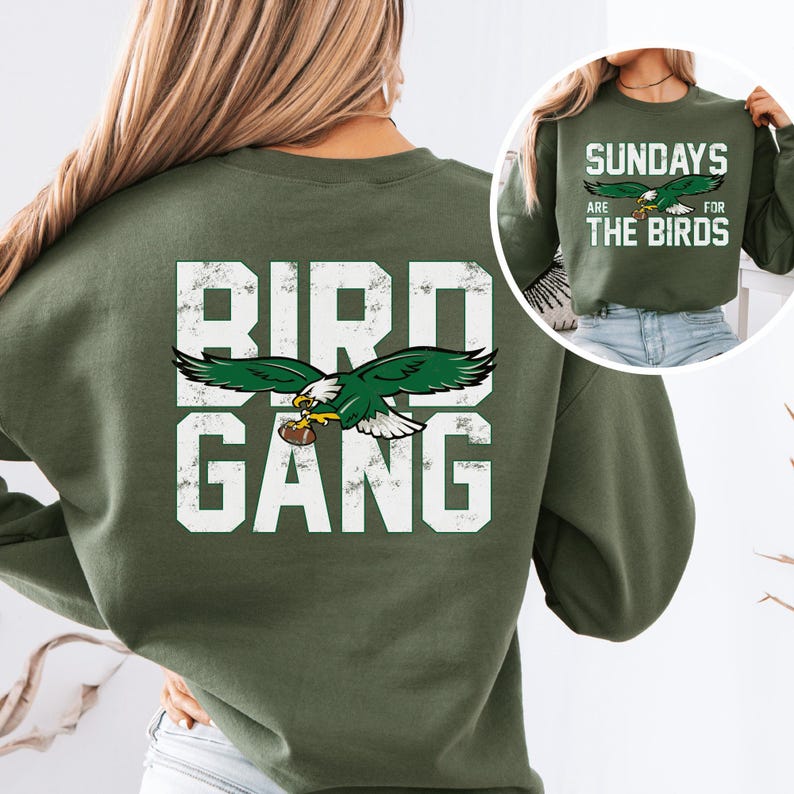 a woman wearing a green bird gang sweatshirt