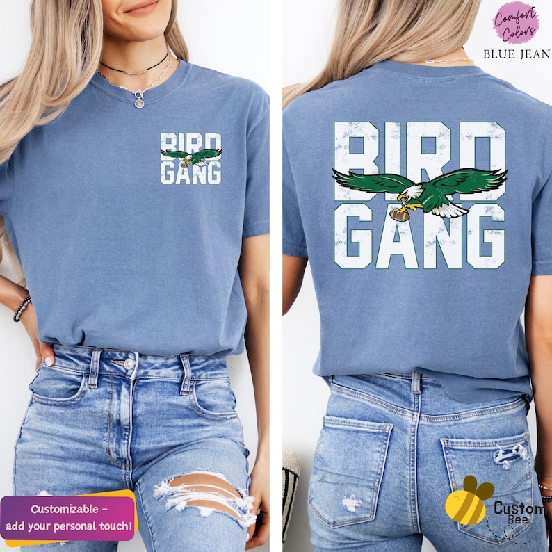 a woman wearing a blue bird gang t - shirt