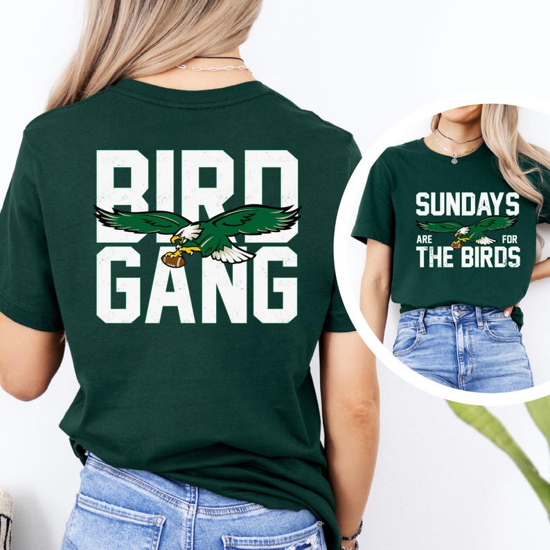 a woman wearing a green bird gang t - shirt