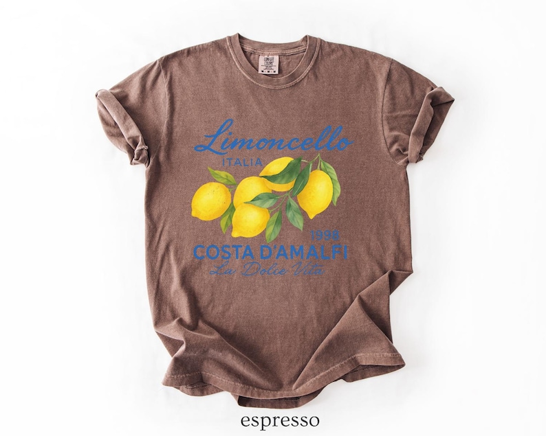 a brown t - shirt with lemons on it