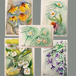 May include: Five watercolor paintings of various flowers. The paintings are on white paper with a light gray background. The flowers are painted in shades of yellow, white, purple, and green. The paintings are signed and dated "PB 2023".