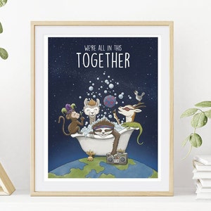 May include: A framed art print featuring a dark blue starry sky background with the text WE'RE ALL IN THIS TOGETHER. A monkey, llama, sloth, and gazelle are in a white bathtub filled with bubbles on top of a globe, with a boombox nearby.