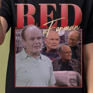 May include: Black t-shirt featuring a graphic of Red Forman from the TV show "That '70s Show." The design includes the name "RED Forman" in red with a gold outline, and multiple images of the character.
