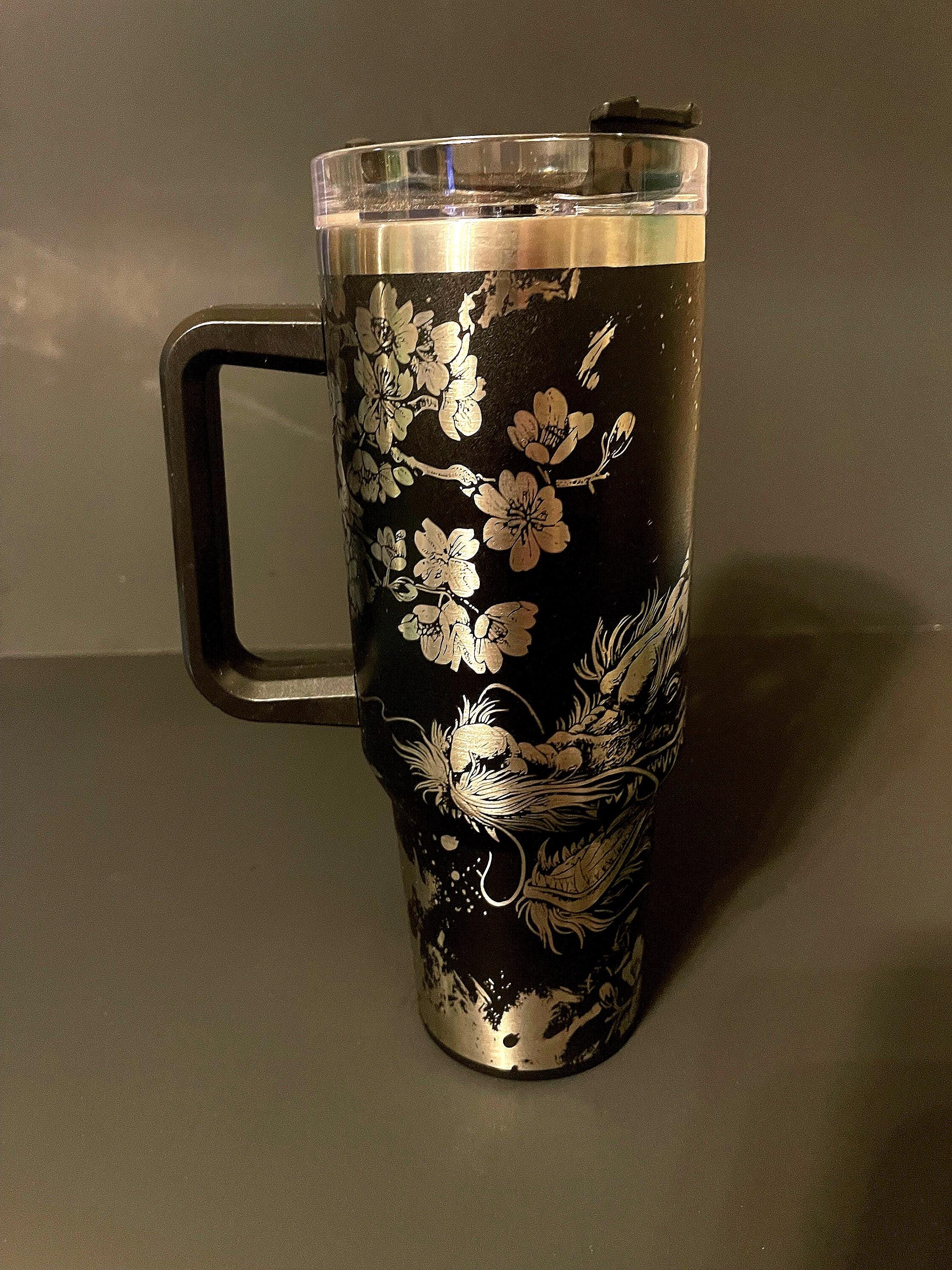 40oz tumbler powder coat with an oriental dragon and cherry blossom scene etched all around, vacuum insulated, oriental style dragon, laser