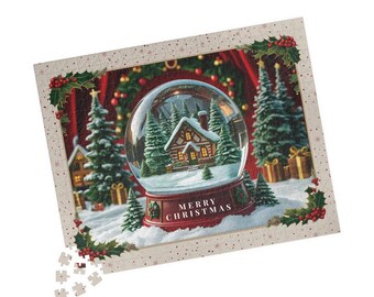 May include: A Christmas-themed jigsaw puzzle featuring a snow globe with a cabin scene, surrounded by evergreen trees and the text "MERRY CHRISTMAS". The puzzle has a decorative border with holly and berries.