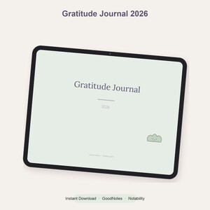 Peut inclure: Une tablette numérique affichant un journal de gratitude 2026 sur un fond vert pâle. L'écran présente le texte Gratitude Journal 2026 et une petite icône de nuage vert souriant. L'interface est conçue pour des applications de prise de notes.
