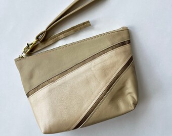 Cleave wristlet pouch, medium. Repurposed pearlescent tan leather and metallic gold suede, gold zipper, fully lined clutch.