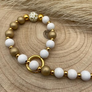 Chaîne de téléphone portable dorée et blanche, collier de perles en bois, élégante, robuste, stable avec mousqueton et insert pour étui/patch de téléphone portable