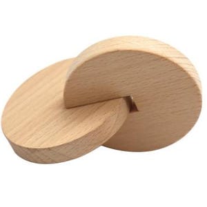 May include: A wooden puzzle consisting of two interlocking circles. The circles are made of light brown wood and have a smooth finish.