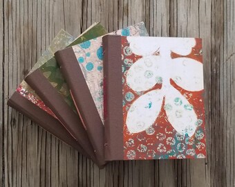 collage painted hardbound journal set of four