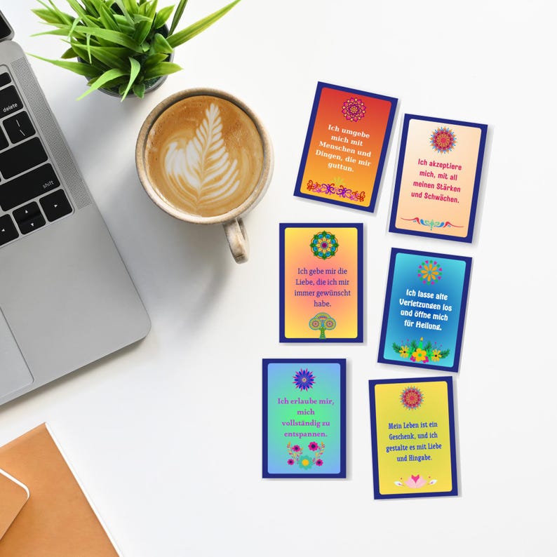 May include: Six colorful affirmation cards with a floral design and inspirational messages in German. The messages include "Ich umgebe mich mit Menschen und Dingen, die mir guttun", "Ich akzeptiere mich, mit all meinen St&auml;rken und Schw&auml;chen", "Ich gebe mir die Liebe, die ich mir immer gew&uuml;nscht habe", "Ich lasse alte Verletzungen los und &ouml;ffne mich f&uuml;r Heilung", "Ich erlaube mir, mich vollst&auml;ndig zu entspannen", and "Mein Leben ist ein Geschenk, und ich gestalte es mit Liebe und Hingabe".