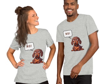 May include: Two people wearing light gray t-shirts. Each shirt features a cartoon dachshund with crossed arms and a speech bubble that says "NO!". The dog is brown with a stern expression. The shirts are short-sleeved.