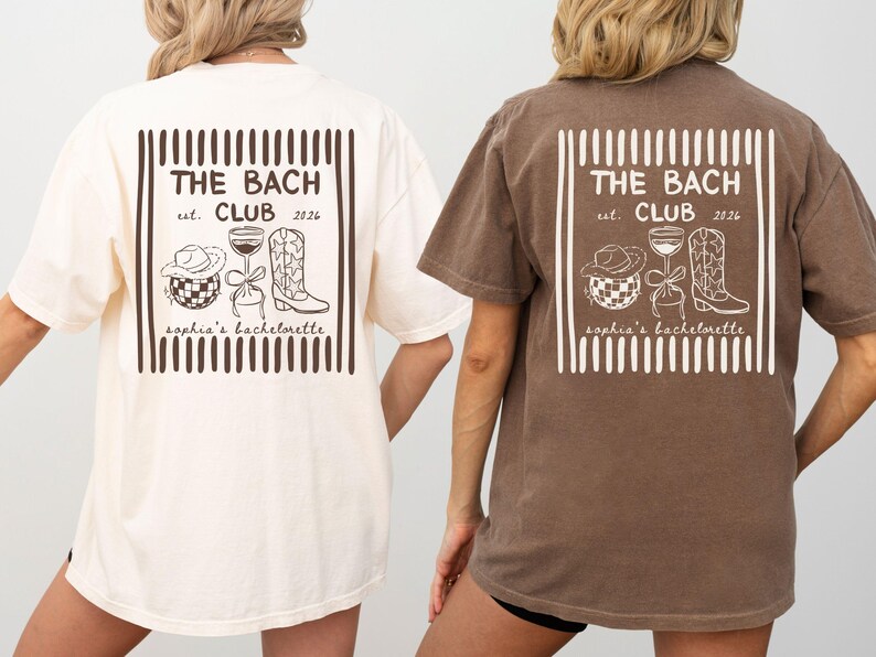 May include: Two oversized t-shirts, one cream and one brown, feature a graphic on the back. The graphic includes the text "THE BACH CLUB est. 2026" and illustrations of a cowboy hat, wine glass, and cowboy boot. The text "sophia's bachelorette" is also included.