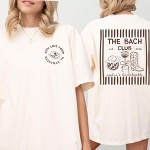 Woman wearing a custom Nashville bachelorette t-shirt with western cowgirl graphics and The Bach Club text, personalized with name and year