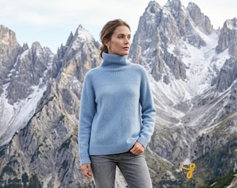 Women's sweater with roll neck made in soft natural yarn blend. color sky blue.