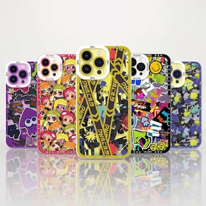 May include: Five smartphone cases featuring various colorful graphic designs. The cases display patterns including cartoon characters, yellow caution tape, graffiti-style ink splatters, and smiley faces, all with cutouts for camera lenses.