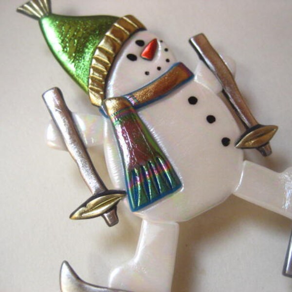 Skiing snowman with chartreuse hat pin brooch