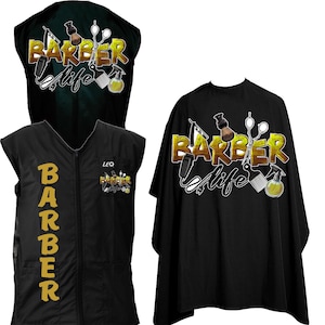 May include: Black barber cape with a gold "Barber Life" design featuring a razor, comb, and scissors. The cape has a zipper closure and a black vest with a gold "Barber" design.