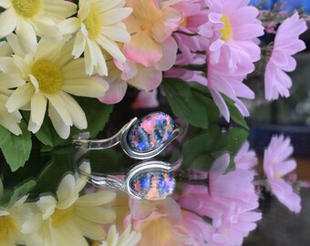 Silver plated over copper cuff bracelet with dichroic cabochon in pink and blue