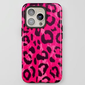 May include: A smartphone case with a vibrant pink leopard print design. The case has a glossy finish and features a pattern of dark brown spots against a bright pink background. The phone's camera lenses are visible at the top.