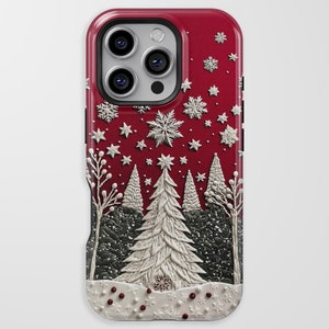 May include: A red phone case featuring a winter scene with white snowflakes, stars, and trees. The design includes a textured, embossed effect, with a white snow-covered ground and red berries. The case has a glossy finish.
