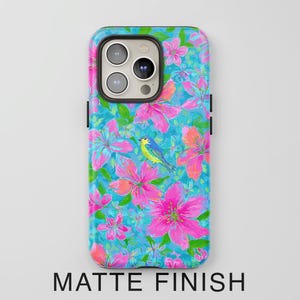 May include: A phone case with a vibrant floral design featuring pink flowers, green leaves, and a blue bird against a turquoise background. The case has a matte finish, with the words "MATTE FINISH" at the bottom.