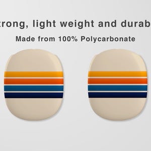 May include: Two beige, oval-shaped objects with horizontal stripes in yellow, orange, and blue. The text above reads "Strong, light weight and durable. Made from 100% Polycarbonate."