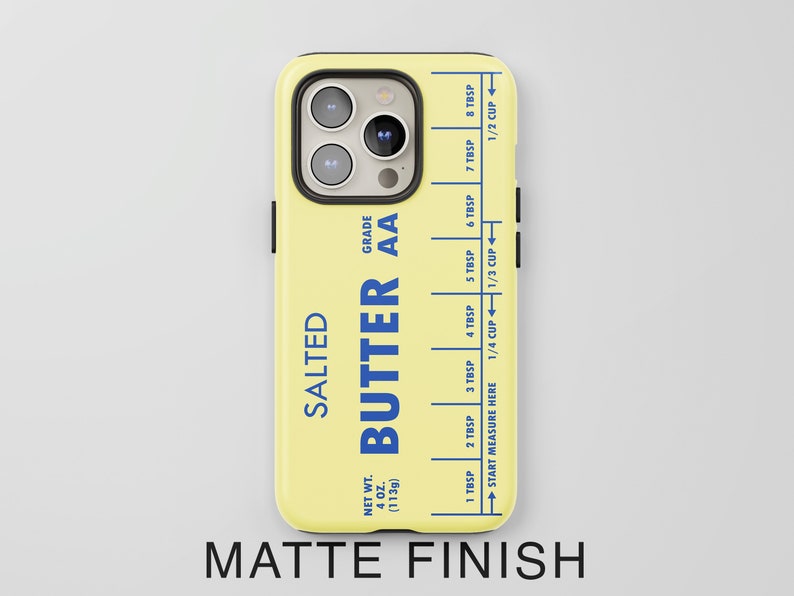 May include: A yellow phone case with a butter stick design. The case has a blue label that says "SALTED BUTTER AA" and includes a measurement guide in tablespoons and cups. The case has a matte finish.