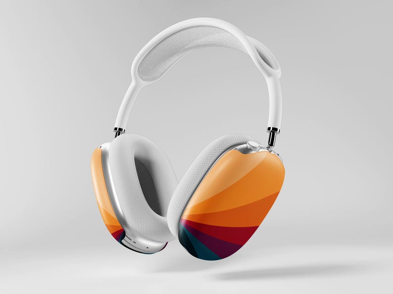 May include: White over-ear headphones with a colorful, striped design on the earcups. The earcups feature a gradient of orange, yellow, red, and blue. The headband and ear cushions are white, and the frame is silver.