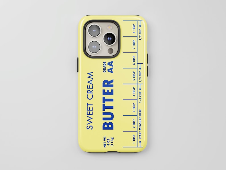 May include: A yellow phone case with a blue and white design that looks like a stick of butter. The case has the text "Sweet Cream Butter AA" and a measurement guide for tablespoons and cups.