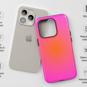 May include: A silver smartphone and a bright pink and orange gradient phone case. The case has a black border and is designed with a dual-layer case for extra durability and protection. It is impact-resistant and compatible with induction chargers.
