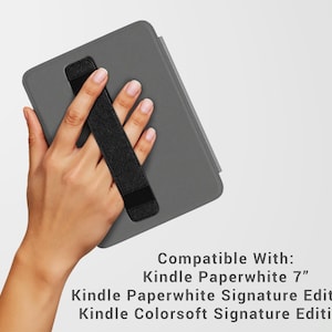May include: A gray Kindle Paperwhite case with a black hand strap. The text on the image reads: Compatible With: Kindle Paperwhite 7", Kindle Paperwhite Signature Edition 7", Kindle Colorsoft Signature Edition 7".