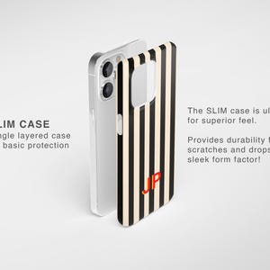 May include: A slim phone case featuring a vertical black and cream stripe pattern with the red monogram letters JP. The text SLIM CASE, Single layered case for basic protection, The SLIM case is ultra thin for superior feel, Provides durability from scratches and drops in a sleek form factor! is visible.
