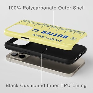 May include: A yellow phone case with a butter stick design. The case is made of polycarbonate and has a black TPU lining. The text on the case reads "SWEET CREAM BUTTER AA GRADE".