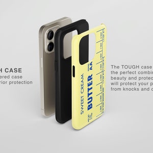 May include: A yellow phone case with a blue and white butter stick design. The case is labeled "Sweet Cream Butter AA". The case is shown with a black and gold phone case.