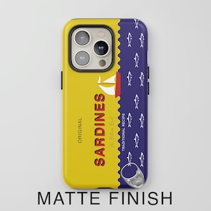 May include: A yellow and blue phone case with a design of a sardine can and the text "ORIGINAL SARDINES In Olive Oil TRADITIONAL RECIPE". The case has a matte finish.