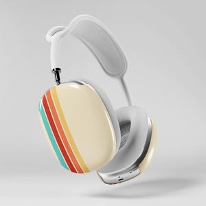 May include: White over-ear headphones with a cream-colored ear cup featuring a retro stripe design in teal, orange, red, and yellow. The headband and ear cushions are white. The headphones have a silver metal trim.